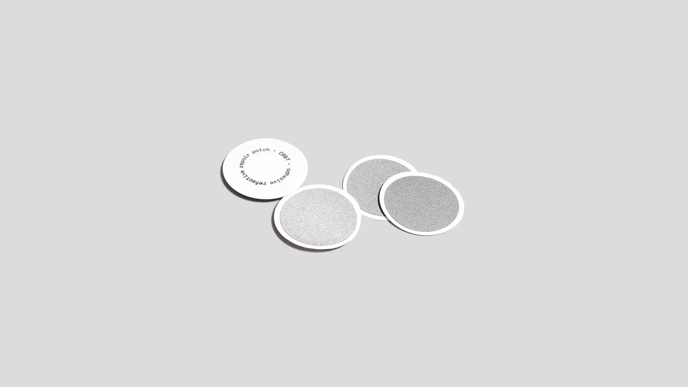 Adhesive reflective repair patch