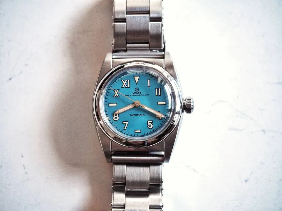 W15 – 9912 / Aged / Turquoise Blue Dial / Metal Bracelet