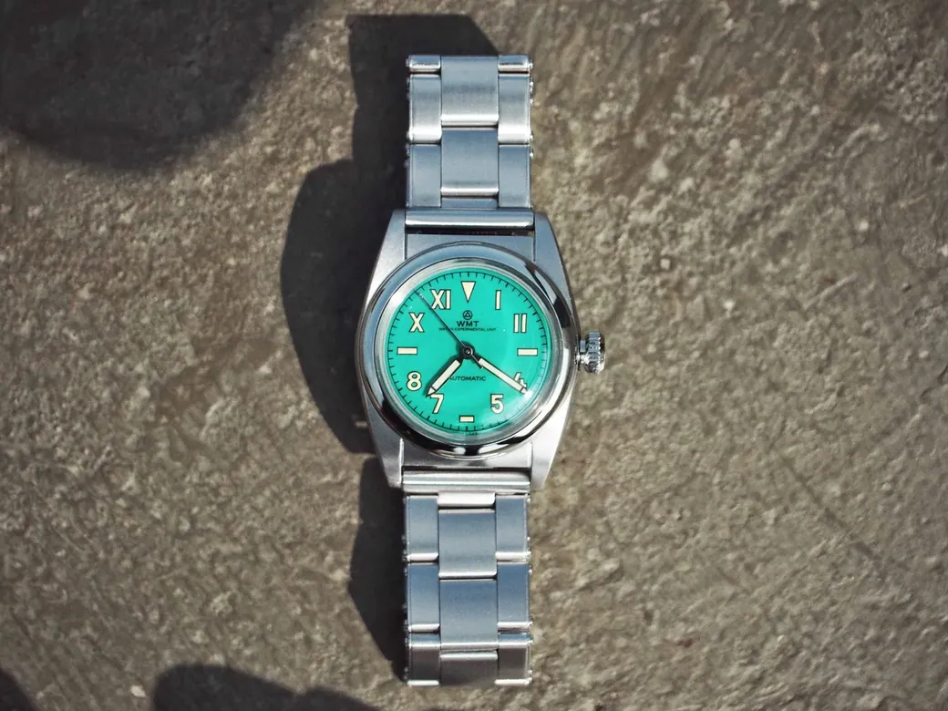W15 – 9912 / Ocean Green Dial / Metal Bracelet